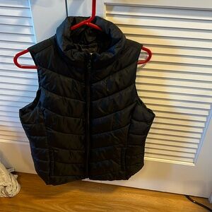 Black puffer vest with pockets